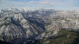 5.5K aerial stock footage approach Wasatch Range mountains with light snow in winter, Utah Aerial Stock Footage | AX126_272E