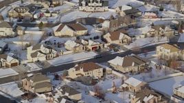 5.5K aerial stock footage of tract homes with winter snow in a small town, Heber City, Utah Aerial Stock Footage | AX127_003E