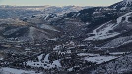 5.5K aerial stock footage of orbiting Park City at sunset with light winter snow, Utah Aerial Stock Footage | AX127_032