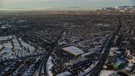 5.5K aerial stock footage approach Downtown Salt Lake City from suburbs at sunset in wintertime, Utah Aerial Stock Footage | AX127_076