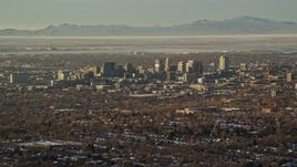 5.5K aerial stock footage of a wide view of Downtown Salt Lake City in winter at sunset, Utah Aerial Stock Footage | AX127_078E
