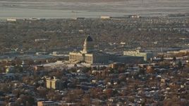5.5K aerial stock footage of Utah State Capitol with snow on the ground at sunset, Salt Lake City Aerial Stock Footage | AX127_083