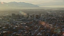 5.5K aerial stock footage orbiting Downtown Salt Lake City with winter snow at sunset, Utah Aerial Stock Footage | AX127_087