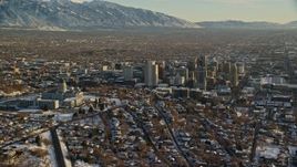 5.5K aerial stock footage orbit the Utah State Capitol and Downtown Salt Lake City buildings with winter snow at sunset Aerial Stock Footage | AX127_092