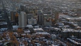 5.5K aerial stock footage orbit Joseph Smith Building, Salt Lake Temple and Tabernacle in downtown with winter snow at sunset, Utah Aerial Stock Footage | AX127_123E