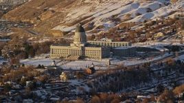 5.5K aerial stock footage fly away from the Utah State Capitol with winter snow at sunset in Salt Lake City Aerial Stock Footage | AX127_126E