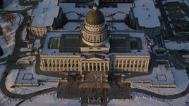 5.5K aerial stock footage tilt to bird's eye view of Utah State Capitol at sunset with winter snow, Salt Lake City Aerial Stock Footage | AX127_139E