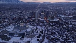 5.5K aerial stock footage orbit Downtown Salt Lake City and reveal the state capitol with winter snow at twilight, Utah Aerial Stock Footage | AX128_005E