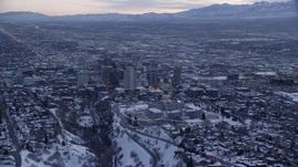 5.5K aerial stock footage orbit north side of the state capitol building and Downtown SLC with winter snow at sunset, Utah Aerial Stock Footage | AX128_015