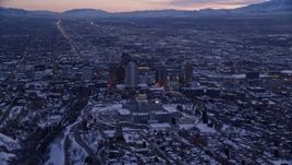 5.5K aerial stock footage fly over north side of the state capitol building to approach Downtown SLC with winter snow at sunset, Utah Aerial Stock Footage | AX128_015E