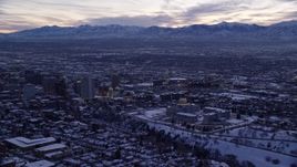 5.5K aerial stock footage of a wide orbit of state capitol and Downtown Salt Lake City with winter snow at twilight, Utah Aerial Stock Footage | AX128_020E