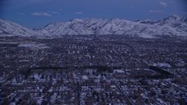 5.5K aerial stock footage of suburban Neighborhoods and Liberty Park with winter snow at twilight, Salt Lake City, Utah Aerial Stock Footage | AX128_029