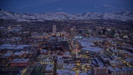 5.5K aerial stock footage of a wide flyby of Downtown Salt Lake City seen from The Gateway in winter at twilight Aerial Stock Footage | AX128_044E