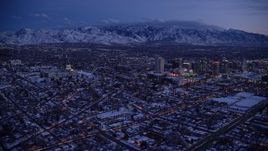 5.5K aerial stock footage wide orbit of Downtown Salt Lake City seen from the northwest near the capitol in winter at twilight, Utah Aerial Stock Footage | AX128_048E