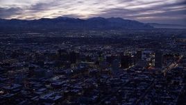 5.5K aerial stock footage of a wide view of Downtown Salt Lake City, Utah with winter snow at twilight Aerial Stock Footage | AX128_055E