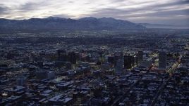 5.5K aerial stock footage orbit east side of Downtown Salt Lake City with winter snow at twilight, Utah Aerial Stock Footage | AX128_056