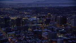 5.5K aerial stock footage of orbiting buildings in Downtown SLC, Utah with winter snow at twilight Aerial Stock Footage | AX128_059