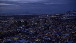 5.5K aerial stock footage of a wide orbit of Downtown Salt Lake City and the capitol with snow at twilight, Utah Aerial Stock Footage | AX128_060