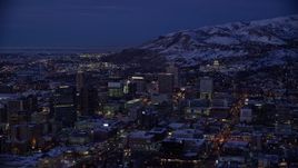 5.5K aerial stock footage of southeast side of Downtown SLC and capitol with winter snow at night, Utah Aerial Stock Footage | AX128_061E