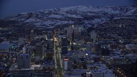 5.5K aerial stock footage orbit from Main to West Temple Street in Downtown Salt Lake City with winter snow at night, Utah Aerial Stock Footage | AX128_063