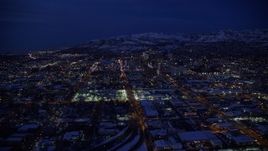 5.5K aerial stock footage approach downtown, fly over West Temple toward State Street, Downtown SLC, Utah with winter snow at night Aerial Stock Footage | AX128_069E
