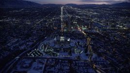 5.5K aerial stock footage approach Utah State Capitol and Downtown SLC with winter snow from the north at twilight Aerial Stock Footage | AX128_078