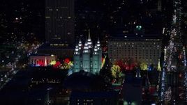 5.5K aerial stock footage orbit capitol building, conference center, zoom in on Salt Lake Temple in winter, night, Downtown SLC, Utah Aerial Stock Footage | AX128_104E