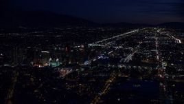 5.5K aerial stock footage wide orbit of Salt Lake Temple and Downtown Salt Lake City, Utah at night in winter Aerial Stock Footage | AX128_110