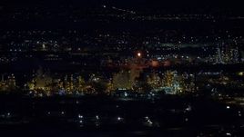 5.5K aerial stock footage of orbiting a large refinery at night in wintertime, Salt Lake City, Utah Aerial Stock Footage | AX128_111E
