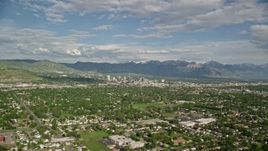 5.5K aerial stock footage of flying over suburbs, approaching Downtown Salt Lake City, Utah Aerial Stock Footage | AX129_001E