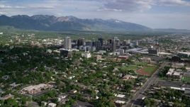 5.5K aerial stock footage of flying by the city's buildings, neighborhoods, sports fields, Downtown Salt Lake City, Utah Aerial Stock Footage | AX129_007