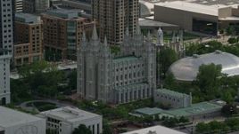 5.5K aerial stock footage of flying by Salt Lake Temple and Mormon Tabernacle, Downtown Salt Lake City, Utah Aerial Stock Footage | AX129_010