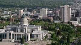 5.5K aerial stock footage of flying by Utah State Capitol, city buildings in Downtown Salt Lake City, Utah Aerial Stock Footage | AX129_042