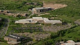 5.5K aerial stock footage of approaching University of Utah office building, tilt to bird's eye view, Salt Lake City Aerial Stock Footage | AX129_069E