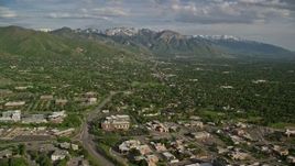 5.5K aerial stock footage of flying over suburbs, approaching Wasatch Range, Salt Lake City, Utah Aerial Stock Footage | AX129_079E