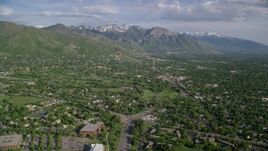 5.5K aerial stock footage of flying over suburbs, approaching Wasatch Range, Salt Lake City, Utah Aerial Stock Footage | AX129_080