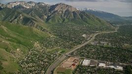 5.5K aerial stock footage fly over suburban neighborhoods, approach Wasatch Range, Salt Lake City, Utah Aerial Stock Footage | AX129_088E