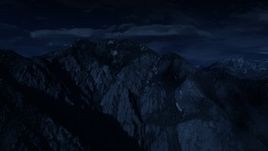 4K day for night color corrected aerial footage of flying by Mount Olympus, Wasatch Range, Utah Aerial Stock Footage | AX129_098_DFN