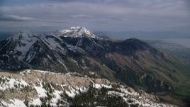 5.5K aerial stock footage approach snowy peaks, Wasatch Range, Utah Aerial Stock Footage | AX129_118