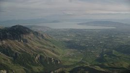 5.5K aerial stock footage of flying by American Fork, Utah Lake, seen from Wasatch Range, Utah Aerial Stock Footage | AX129_119