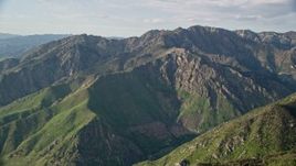 5.5K aerial stock footage of passing by Mount Olympus in the Wasatch Range, Mount Olympus, Utah Aerial Stock Footage | AX129_133E