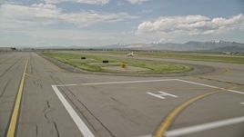 5.5K aerial stock footage of tracking an airplane taking off, Salt Lake City International Airport, Utah Aerial Stock Footage | AX130_001E