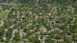 5.5K aerial stock footage of passing by suburban neighborhoods, West Jordan, Utah Aerial Stock Footage | AX130_023
