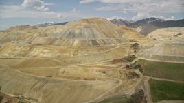 5.5K aerial stock footage of passing by Bingham Canyon Mine (Kennecott Copper Mine), Utah Aerial Stock Footage | AX130_033E