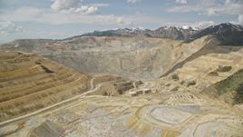 5.5K aerial stock footage orbit Bingham Canyon Mine (Kennecott Copper Mine), Utah Aerial Stock Footage | AX130_037E