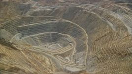 5.5K aerial stock footage orbit of gravel haulers, Kennecott Copper Mine aka Bingham Canyon Mine, Utah Aerial Stock Footage | AX130_044E