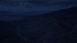4K day for night color corrected aerial footage of approaching rugged mountain ridges, Oquirrh Mountains, Utah Aerial Stock Footage | AX130_064_DFN