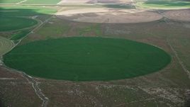 5.5K aerial stock footage of orbiting green circular crop fields, Elberta, Utah Aerial Stock Footage | AX130_086