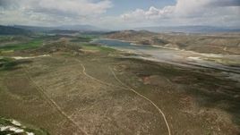 5.5K aerial stock footage of approaching the Gunnison Reservoir with low water, Sanpete County, Utah Aerial Stock Footage | AX130_150E