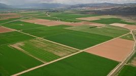 5.5K aerial stock footage fly over farmland, pan to Route 118, Richfield, Utah Aerial Stock Footage | AX130_186E